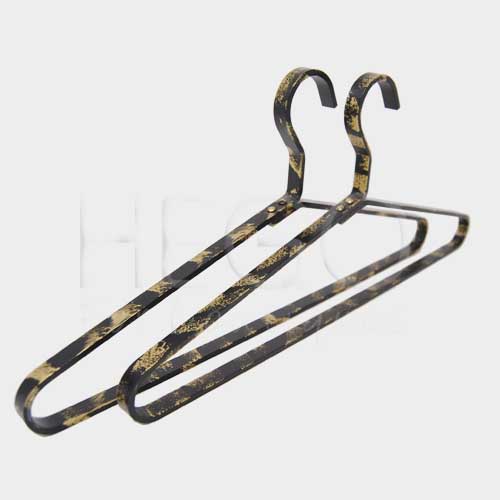 Black and gold metal hanger